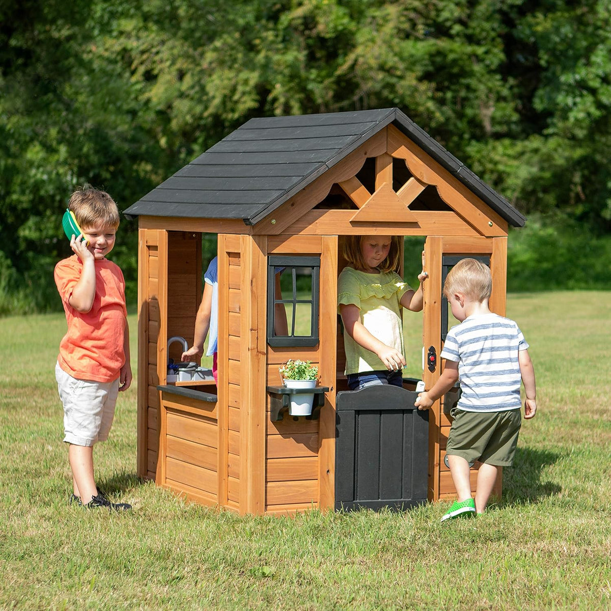 Backyard Discovery Sweetwater Cedar Wooden Kids Playhouse Cottage with Play Kitchen, Snack Bar, Half Door, Toy Phone, Windows, Flowerpot Holders, and Working Doorbell for Outdoor Imaginative Play