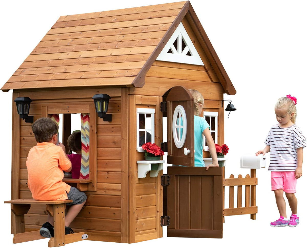 Backyard Discovery Aspen Cedar Wooden Kids Playhouse Cottage with Play Kitchen, Snack Bar, Picnic Bench, Dinner Bell, Mailbox, Dutch Door, Flowerpot Holders, Toy Lights, Country Style for Outdoor Play