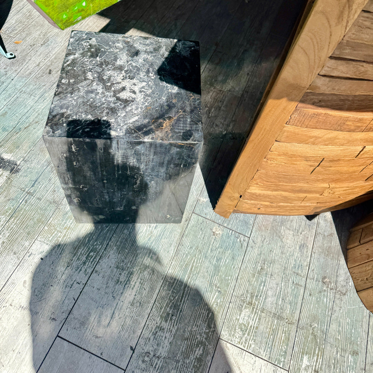 Outdoor setting with a stone stool