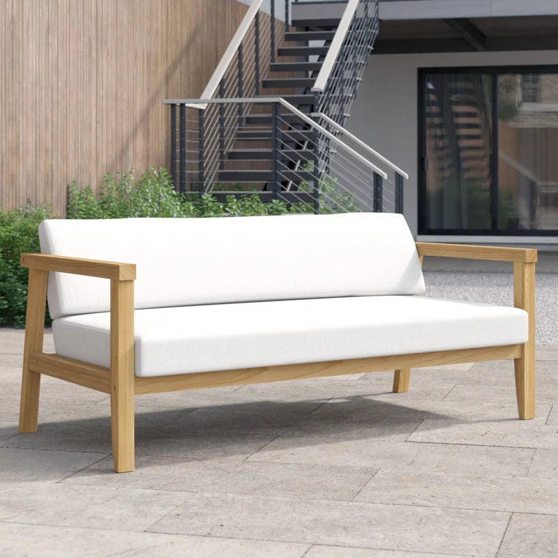 Bayport teak loveseat on a patio