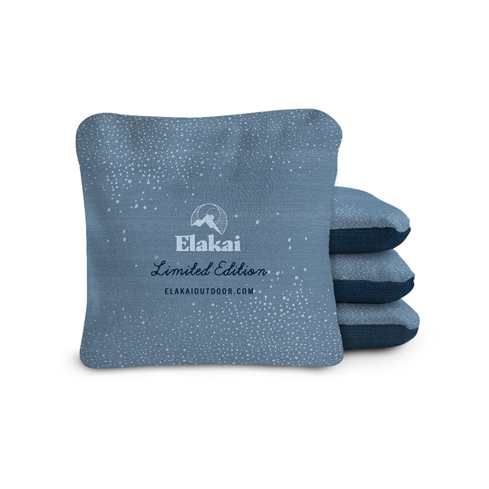 Blue textured pillow with 'Elakai' branding on a white background