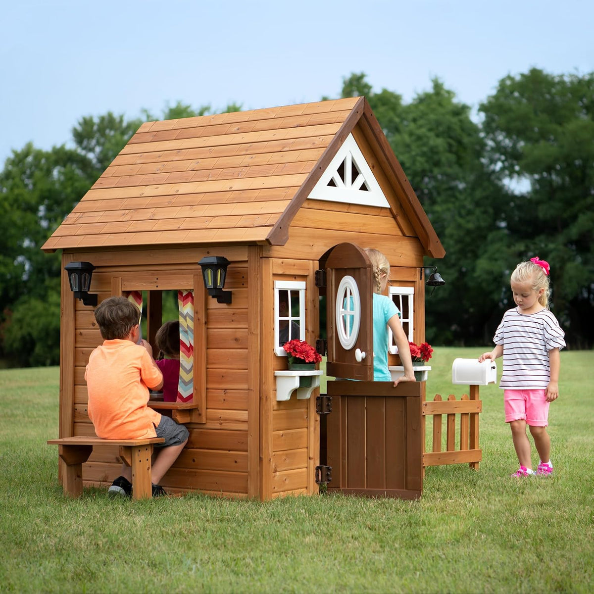 Backyard Discovery Aspen Cedar Wooden Kids Playhouse Cottage with Play Kitchen, Snack Bar, Picnic Bench, Dinner Bell, Mailbox, Dutch Door, Flowerpot Holders, Toy Lights, Country Style for Outdoor Play