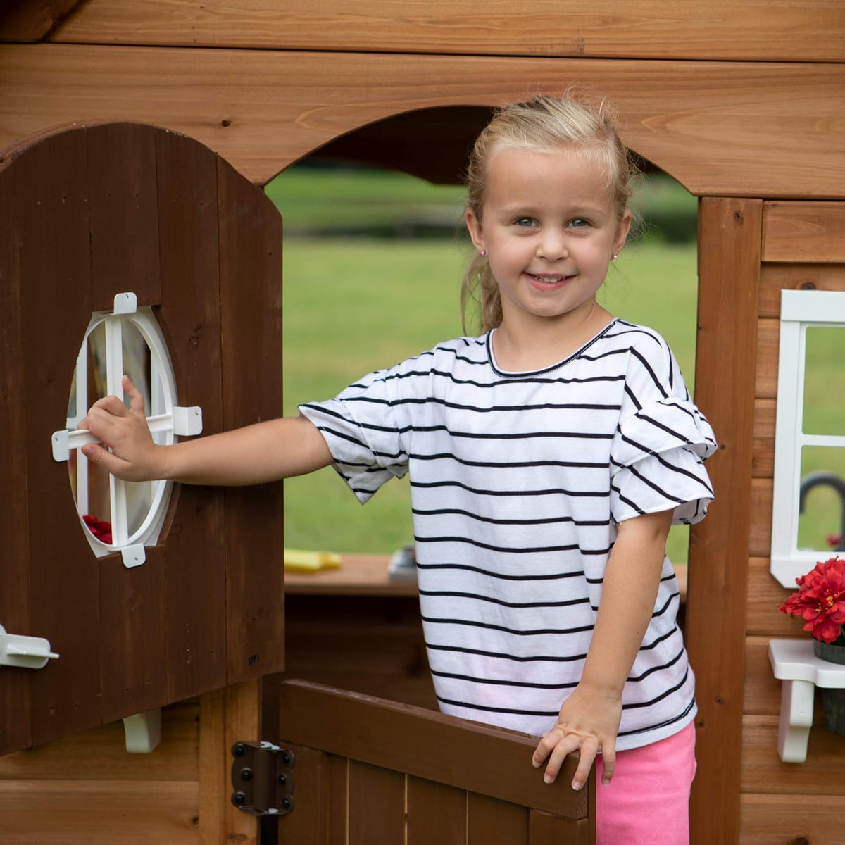 Backyard Discovery Aspen Cedar Wooden Kids Playhouse Cottage with Play Kitchen, Snack Bar, Picnic Bench, Dinner Bell, Mailbox, Dutch Door, Flowerpot Holders, Toy Lights, Country Style for Outdoor Play