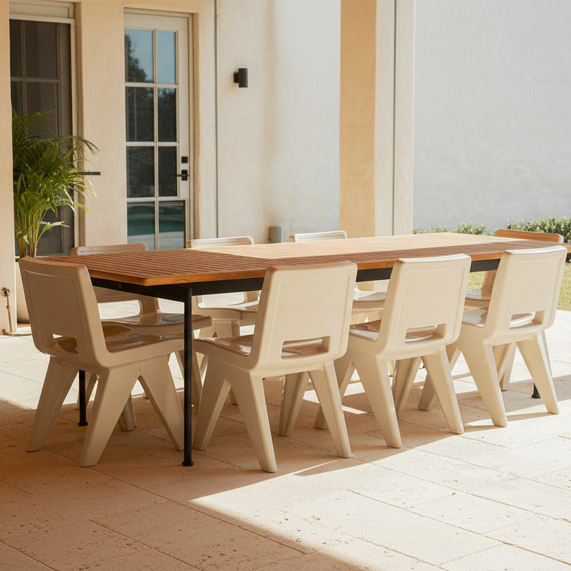 Outdoor dining table with beige chairs on a patio