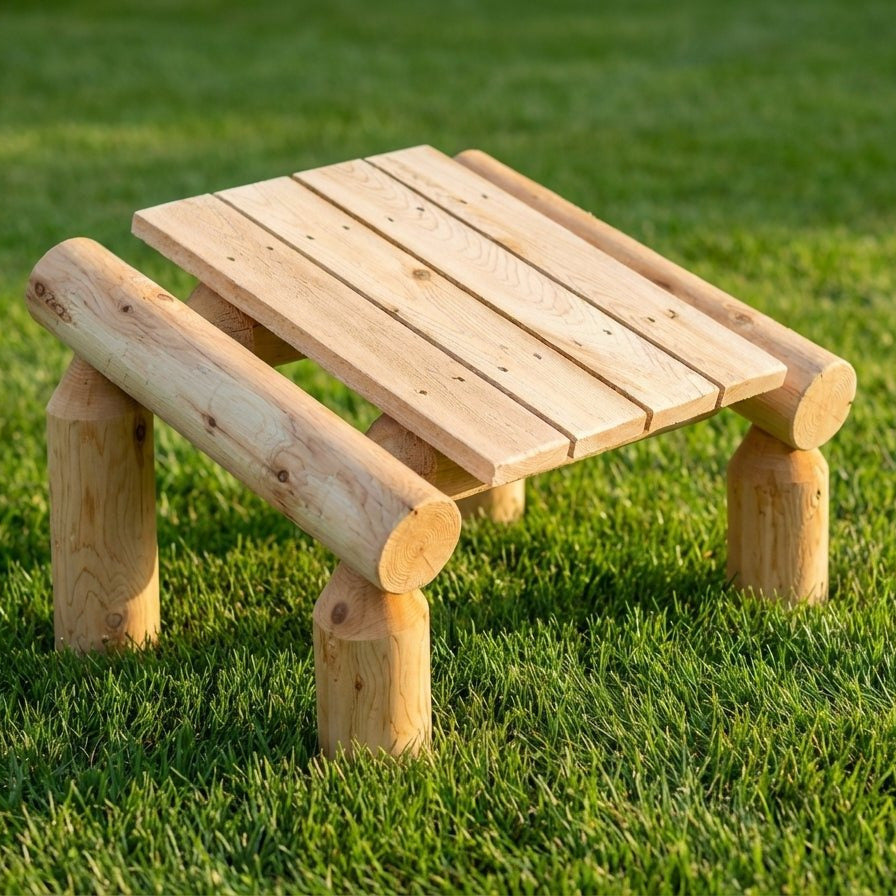 Wooden children's table on a grassy field